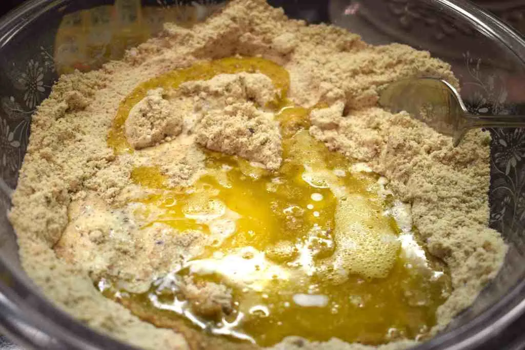 mixing keto cinnamon roll dry and wet ingredients