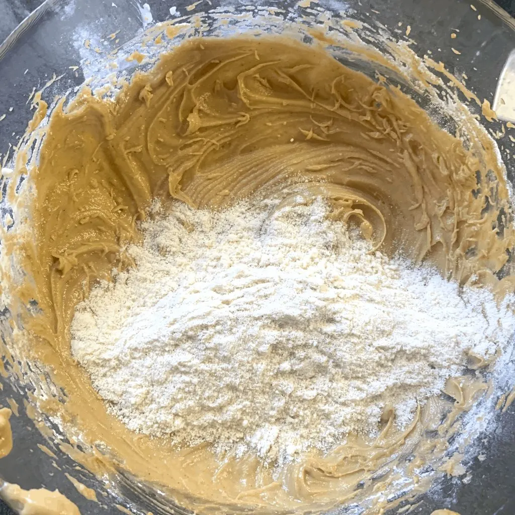 Mix dry ingredients into keto peanut butter batter Mix dry ingredients into keto peanut butter batter