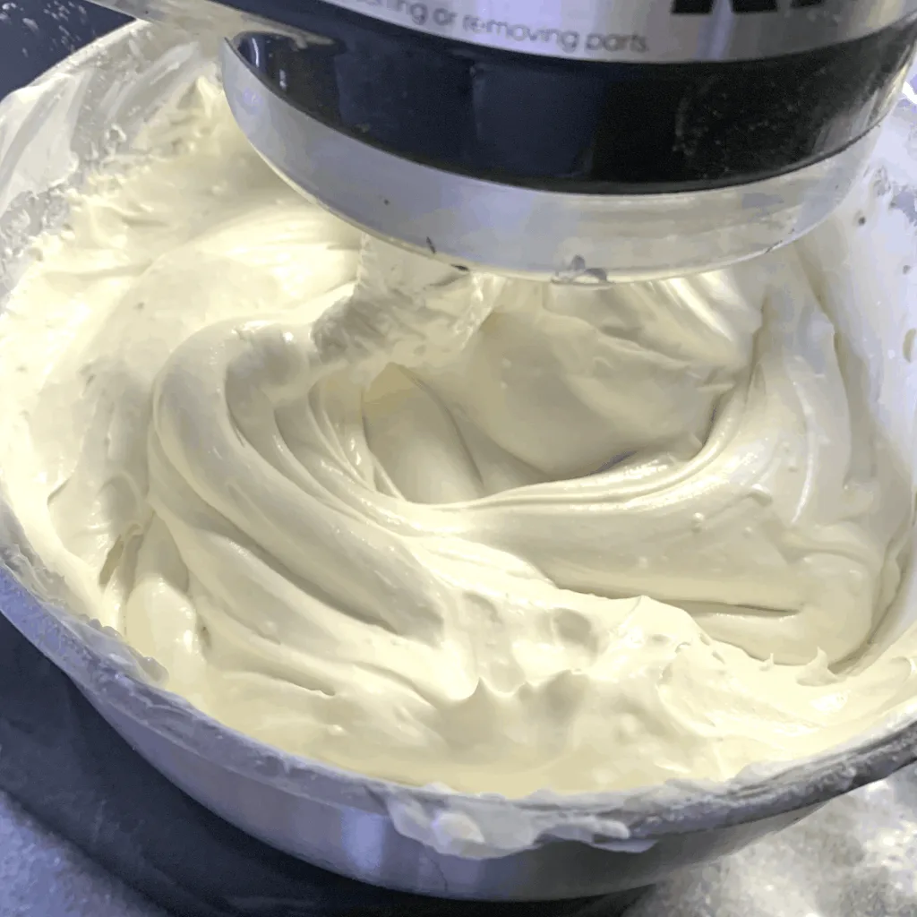 mixing cream cheese and sour cream