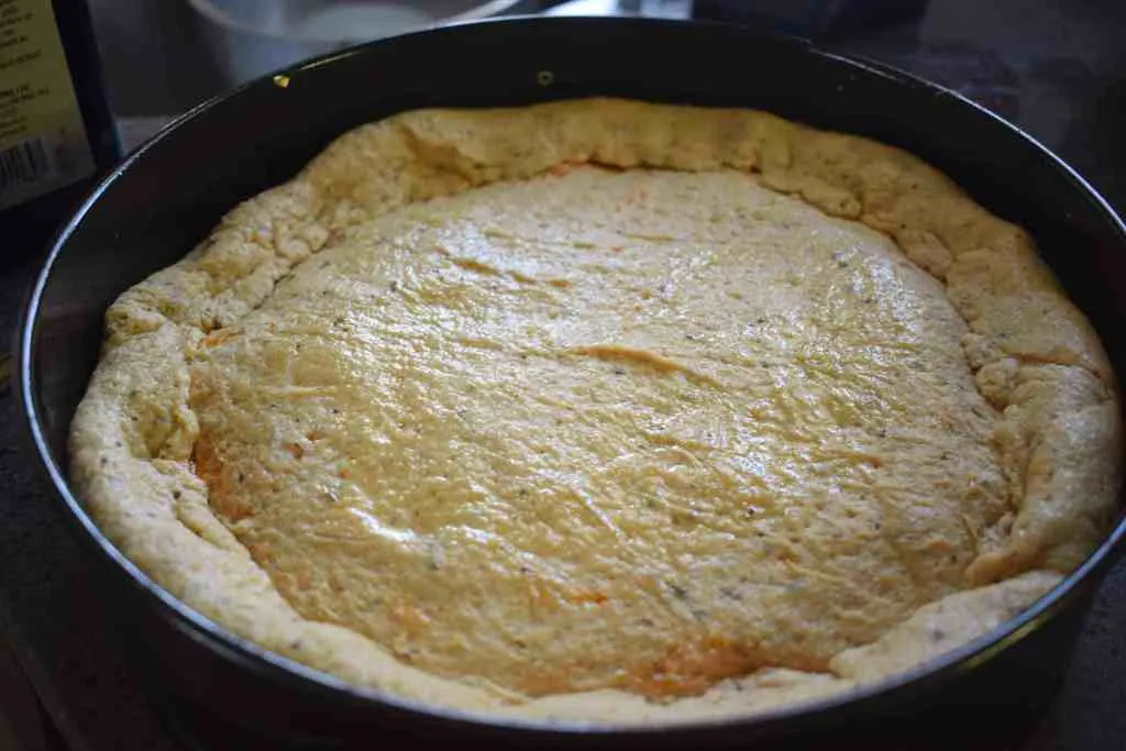 keto deep dish pizza dough brushed with olive oil