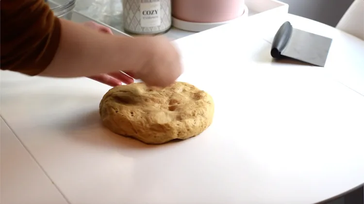 flattening bread dough