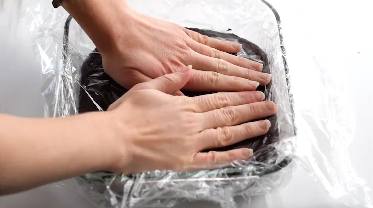 pressing plastic wrap fudge